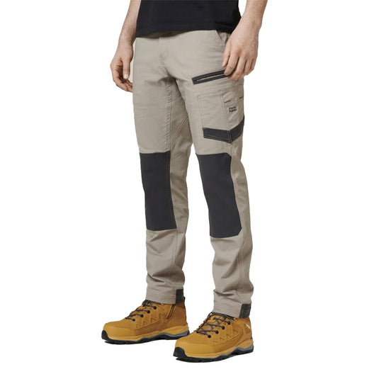 Hard Yakka 3056 Raptor Comfort Fit Work Pant designed for durability and mobility, featuring triple needle stitching, reflective logos, reinforced zones, and functional pockets, ideal for active workplace environments.