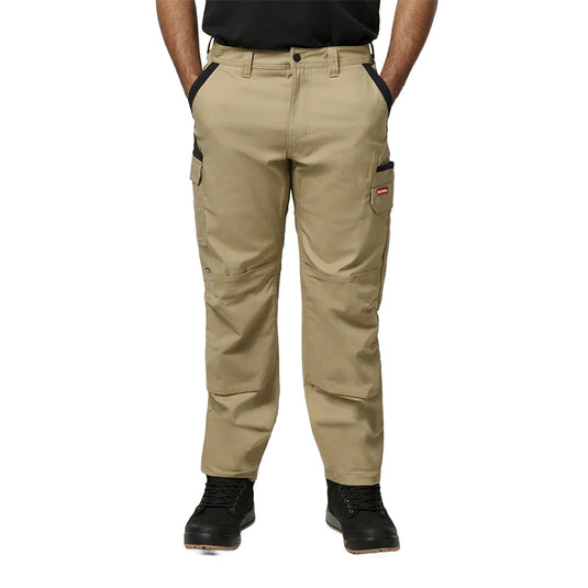 Hard Yakka Legends Slim Fit Stretch Work Pants, showcasing modern utility with multiple thigh pockets and a tapered fit, worn with black work boots, embodying durable workwear from Active Safety's trusted collection.