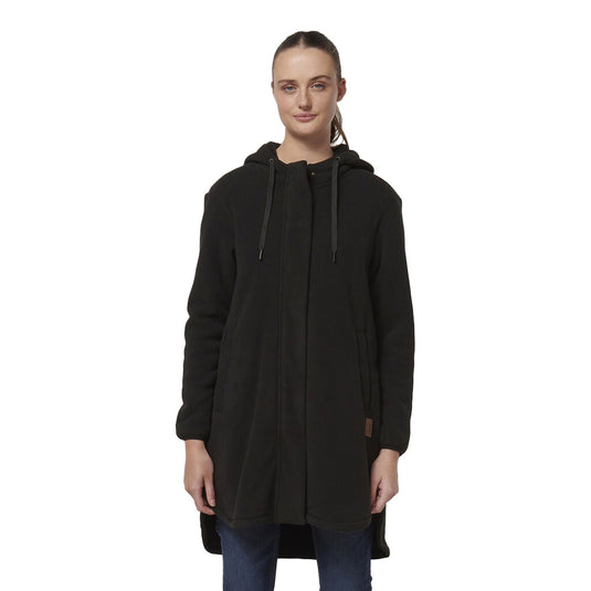 Hard Yakka Women's Longline Zip Hoodie in black, features a longline design, sherpa-lined hood, and curved hem with side splits for movement. Includes two-way zipper and slanted pockets for warmth.