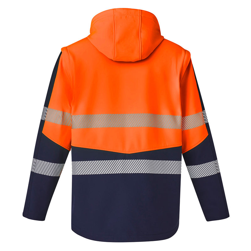 Load image into Gallery viewer, Syzmik 2-in-1 Stretch Soft Shell Taped Jacket featuring a hood, zip-off sleeves, and two front zip pockets, designed for comfort and movement, ideal for safety and workwear environments.