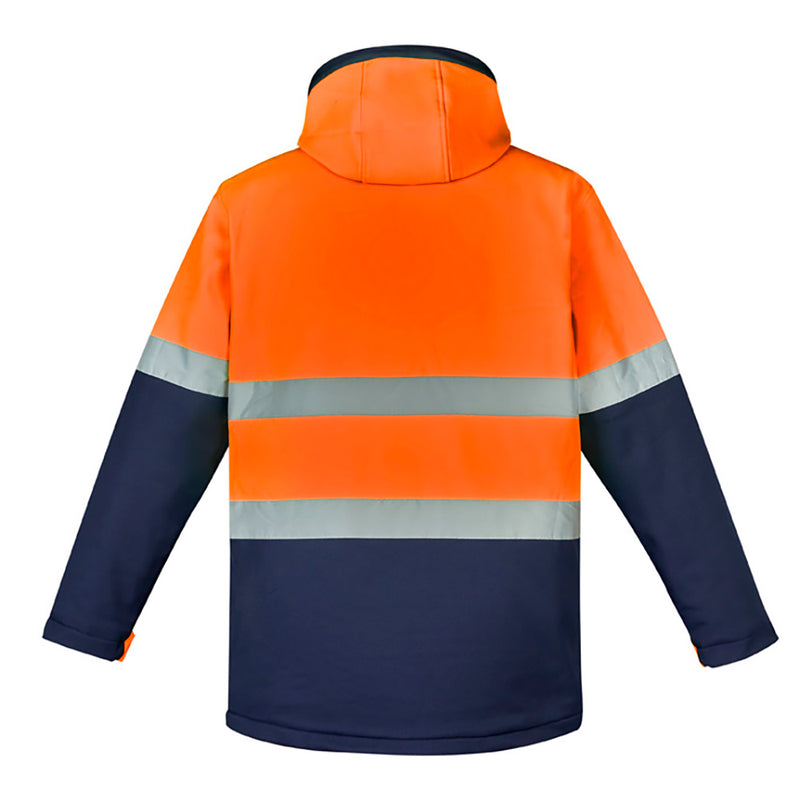 Load image into Gallery viewer, Syzmik Hi Vis Antarctic Softshell Taped Jacket with reflective stripes, featuring a zip-off hood, storm flap closure, and multiple pockets, designed for warmth and protection in cold, harsh conditions.