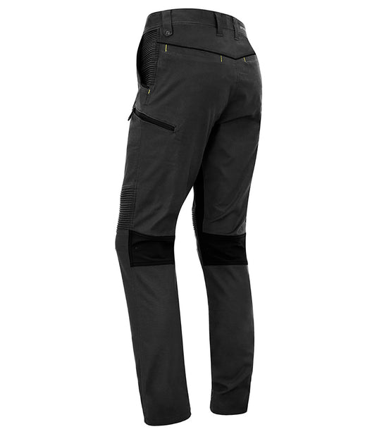 Syzmik Streetworx Stretch Pant (Non-Cuffed) showcasing a modern slim fit, two large pockets with black bonded zips, and unique stretch pleating for enhanced movement, ideal for active work environments.