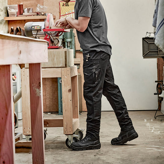 Syzmik Mens Rugged Cooling Stretch Pants feature a durable ripstop design with stretch fabric for mobility, modern straight fit, reinforced knees, and multiple utility pockets, ideal for active workplace safety.