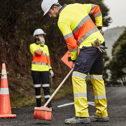 Syzmik Hi Vis Bio Motion Taped Pant with Bio Motion tape, side loop for traffic wand, large cargo and mobile phone pockets, plus multiple hip and pen pockets, ideal for workplace safety.