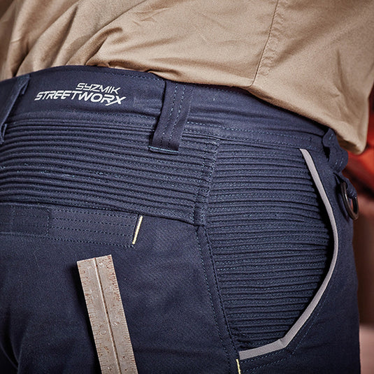 Syzmik Mens Streetworx Stretch Shorts featuring a ruler in the pocket, highlighting their practical design for active work environments, with a modern fit and comfortable stretch fabric.