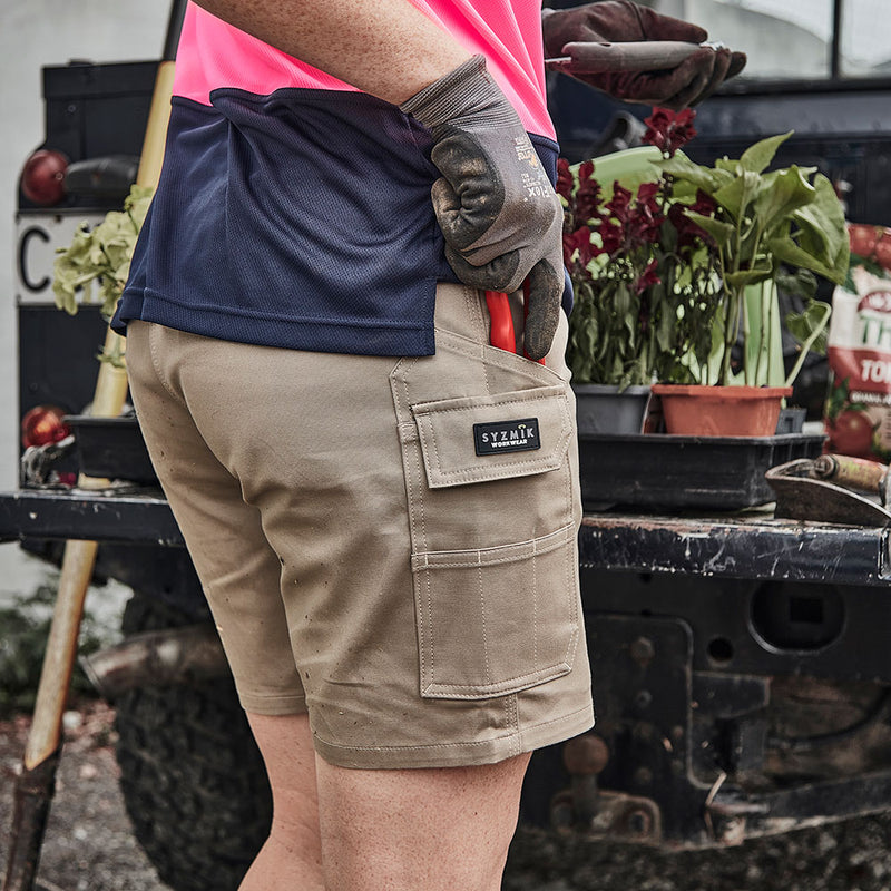 Load image into Gallery viewer, Syzmik Womens Essential Stretch Cargo Short featuring a slim fit above the knee, triple-stitched seams, and multiple pockets including a large welt pocket and mobile phone pocket, ideal for active work environments.
