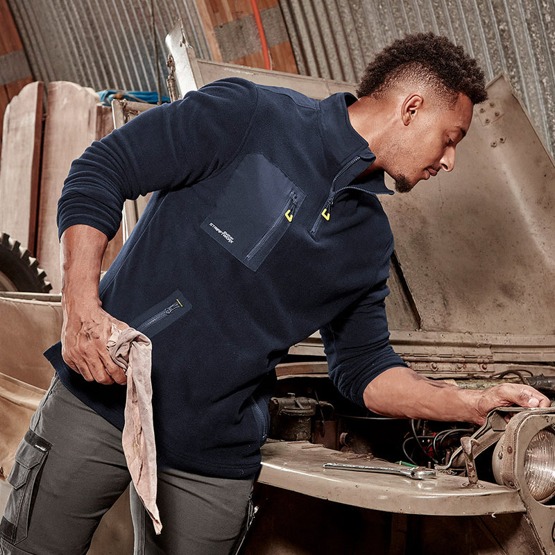 Load image into Gallery viewer, Syzmik Streetworx Lightweight 1/4 Zip Polar Fleece features a soft polar fleece fabric with upper back reinforcement, a chest pocket, two zippered hip pockets, and reflective branding, ideal for safety-conscious workwear.