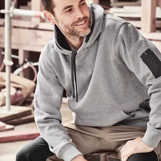 Syzmik Multi Pocket Fleece Lined Hoodie featuring a safety drawstring, woven arm pen pocket, angled side hip pockets, and kangaroo pockets, designed for durability and warmth in active work environments.