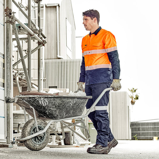 Syzmik Mens Taped Utility Pant, Stout: Durable work pants featuring reflective tape, reinforced heel and pocket patches, wide belt loops, and triple-stitched seams, ideal for tough jobs while maintaining comfort.