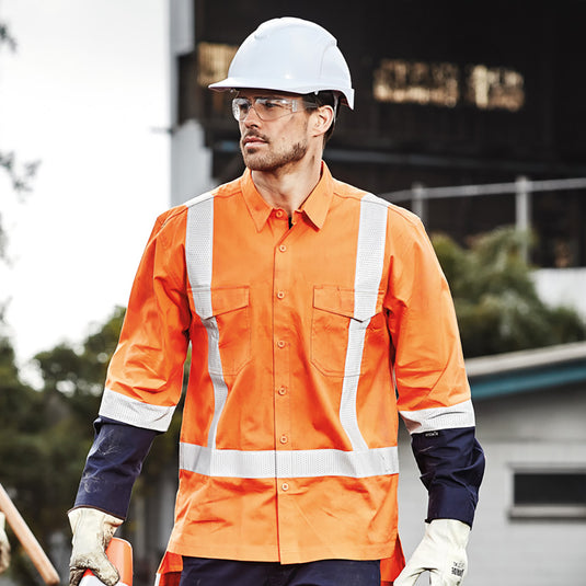 Syzmik Rugged Cooling TTMC-W17 L/S Work Shirt featuring mesh venting and reinforced stress points, worn by a man with a white hard hat, showcasing its durable workwear design for safety environments.