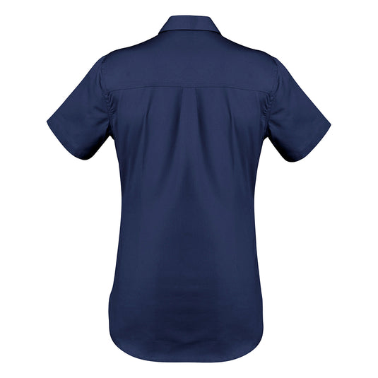 Syzmik Womens Lightweight Tradie S/S Shirt displayed on a mannequin features short sleeves and a darted feminine fit, complete with a button flap pocket and underarm vent eyelets for enhanced breathability.