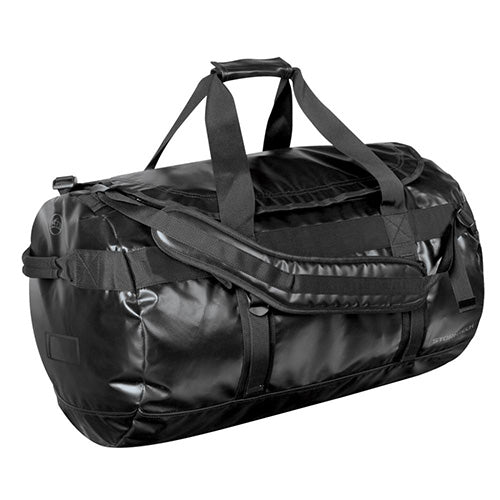 Load image into Gallery viewer, Stormtech Waterproof Gear Bag - Large, black duffel with adjustable padded shoulder straps for backpack use, heavy-duty reinforced PVC, ID pocket, end handles, ideal for safety gear and work essentials.