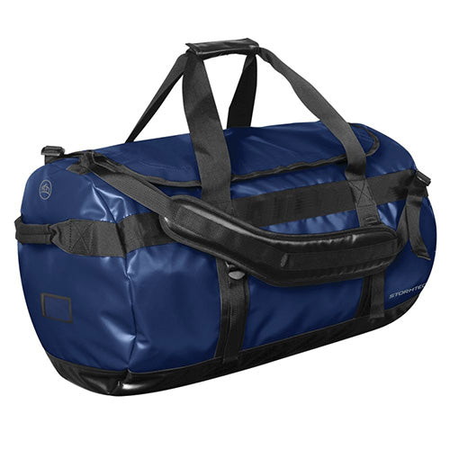 Load image into Gallery viewer, Stormtech Waterproof Gear Bag - Large, featuring black straps and heavy-duty reinforced PVC fabric, designed for durability and versatility with adjustable padded shoulder straps and additional handles, perfect for storing essentials securely.