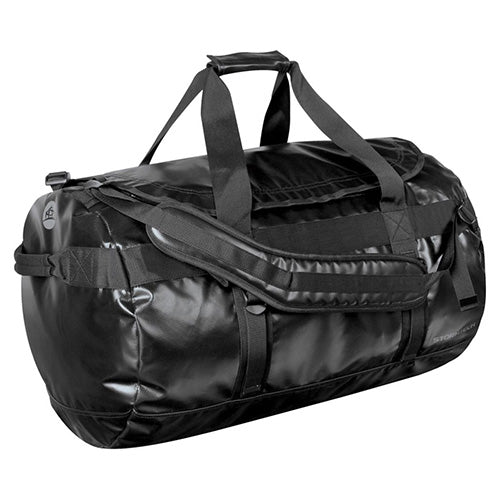 Load image into Gallery viewer, Stormtech Waterproof Gear Bag - Medium, a durable black duffel with adjustable padded shoulder straps, ID pocket, and additional handles, ideal for safety gear and workplace essentials. Capacity: 88.5L.
