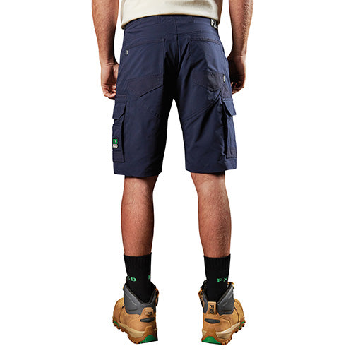 Load image into Gallery viewer, FXD LS-1 Lightweight Stretch Work Short with visible utility pockets and durable construction, worn by a standing man, showcasing its ergonomic design for active safety and workplace efficiency.