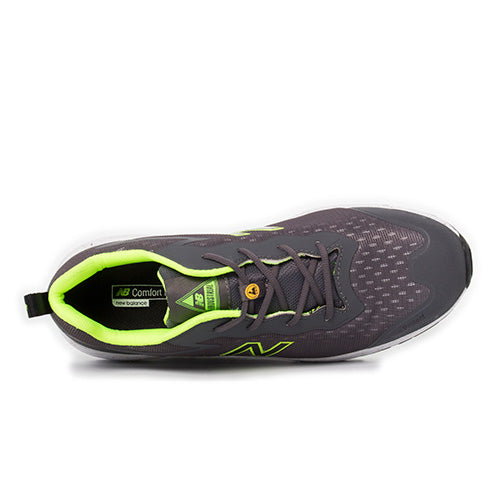 New Balance Logic Safety Shoe, Grey/Lime, showcasing a sleek design with a composite toe and slip-resistant outsole. Features include a Kevlar midsole and NB Comfort Insert, ideal for workplace safety and comfort.