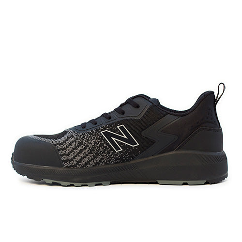 New Balance Speedware Safety Shoe, Black/Black, featuring a bold white letter detail. Designed for active workers, it offers slip resistance, Kevlar midsole, and composite toe for enhanced safety.