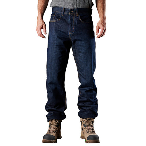 Load image into Gallery viewer, FXD WD-2 Original Denim Work Jeans, shown on a man in boots, feature durable DURA500™ abrasion panels. Ideal for workplace safety, these jeans highlight quality and resilience from renowned Cone Denim™ mills.