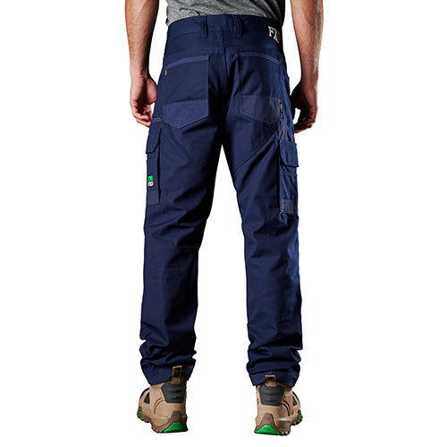 The FXD WP-1 Original Work Pant, designed for durability, features blue denim-like appearance with visible pockets. Ideal for workwear, it incorporates advanced abrasion-resistant panels for enhanced performance in demanding environments.