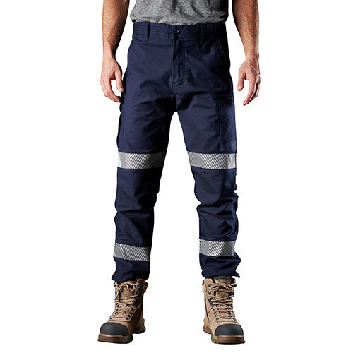 FXD WP-3 Reflective Stretch Work Pant features a man wearing navy work pants with reflective stripes, showcasing durable construction with abrasion-resistant panels and segmented reflective tape for enhanced visibility and comfort.