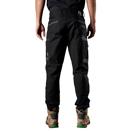 Load image into Gallery viewer, FXD WP3 Stretch Work Pant worn by a man, showcasing regular fit with slimmer leg and DURA500™ abrasion panels on the pockets, ideal for active workplace safety and comfort.