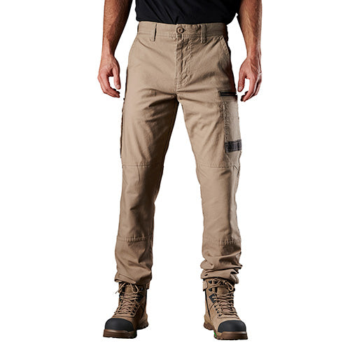 Man wearing FXD WP3 Stretch Work Pants, showcasing regular fit and slimmer leg design, emphasizing comfort and durability with abrasion-resistant pocket panels, ideal for workplace safety and movement.