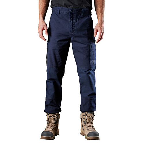 FXD WP3 Stretch Work Pant worn by a standing man, showcasing their regular fit and slimmer leg design, ideal for workplace comfort and durability with advanced abrasion panels on the pockets.