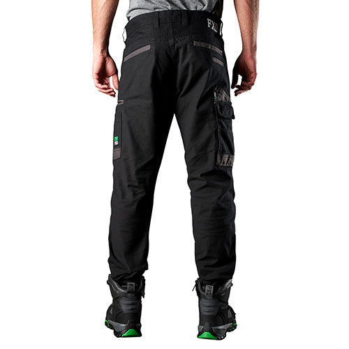 FXD WP-4 Stretch Cuffed Work Pants, featuring elastic cuffed ankles and abrasion-resistant pocket panels, are showcased on a person. Ideal for comfort and mobility, aligning with Active Safety's workwear offerings.