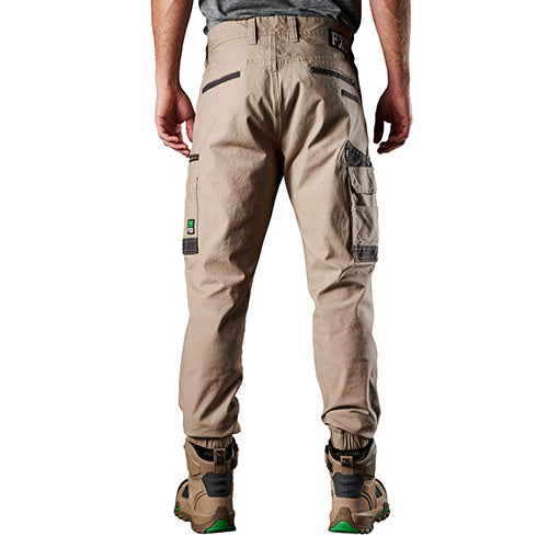 FXD WP-4 Stretch Cuffed Work Pants worn by a man, showcasing their elastic cuffed ankles and durable pocket panels, ideal for comfort and movement in active work environments.