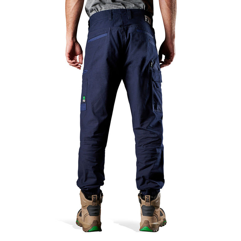 Load image into Gallery viewer, FXD WP-4 Stretch Cuffed Work Pants shown on a man, highlighting their regular fit, slimmer leg, and elastic cuffed ankles. Ideal for comfort and movement, perfect for active safety needs.