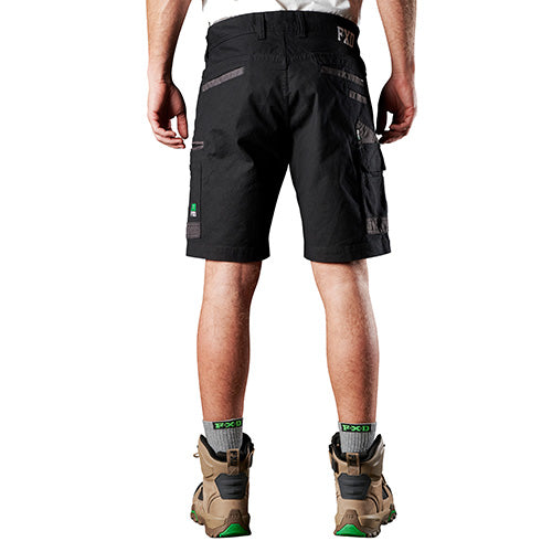 FXD WS-3 Stretch Work Shorts displayed by a man, showcasing their regular fit with slimmer leg and Dura500™ abrasion panels on pockets, designed for superior movement and comfort in work environments.