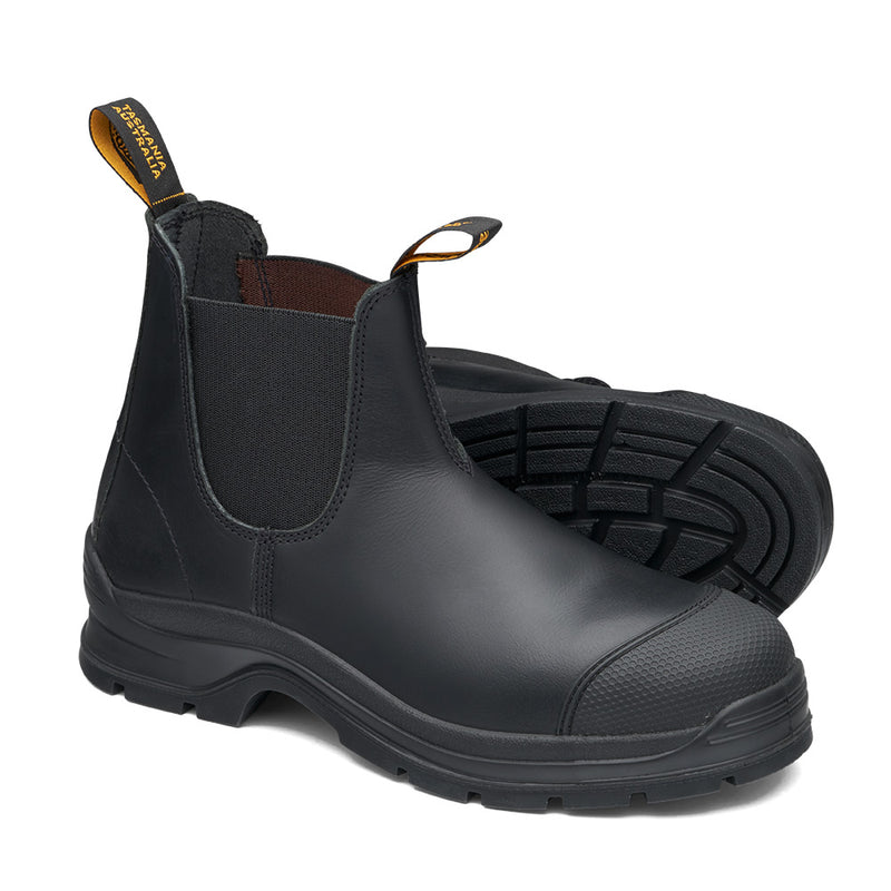 Load image into Gallery viewer, Blundstone 320 Slip On Safety Boot, Black: Black Chelsea-style ankle boots with elastic sides, reinforced toes, textured outsoles, and pull-tabs, featuring a toe scuff guard and ergonomic design for durability and comfort.

