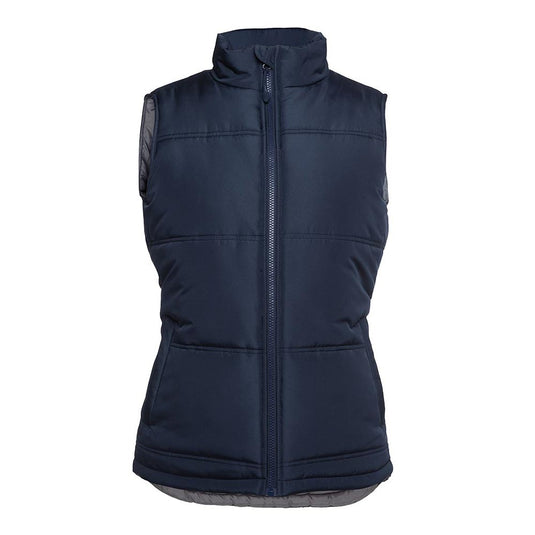 JB's Ladies Adventure Puffer Vest features a quilted, sleeveless design with a high collar and chunky front zipper, complemented by two front pockets with water-shedding flaps, ideal for active safety needs.