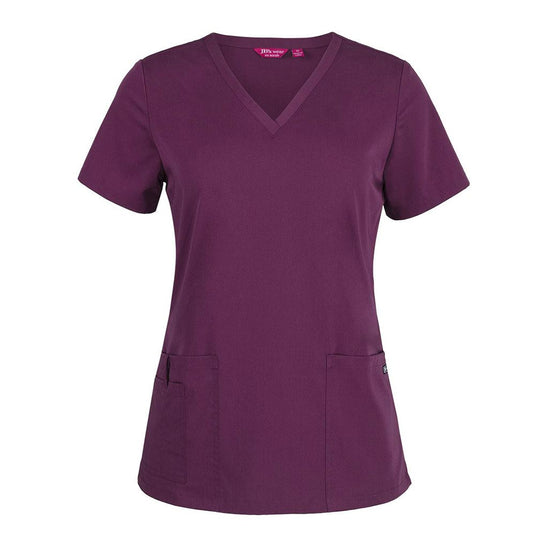 JB's Ladies Nu Scrub Top features a deep plum V-neck design with two hip patch pockets, a pen insert, and a key loop, ideal for comfortable, durable professional wear.