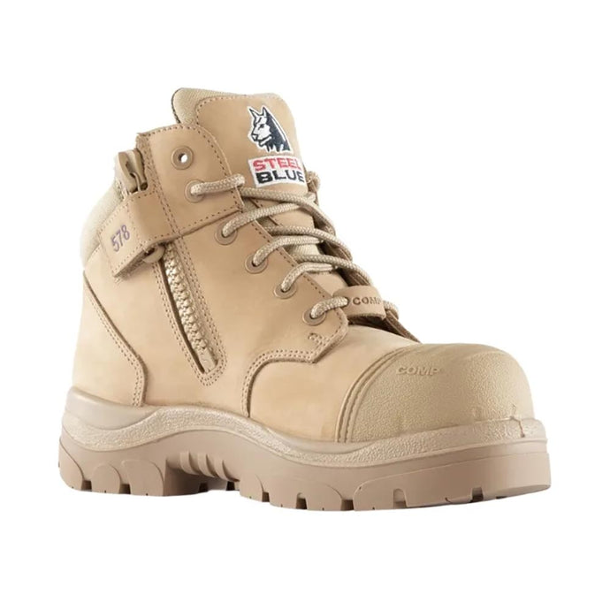 Steel Blue Parkes Ladies Zip Composite Safety Boot in Sand features an ankle-height design with a side zip, composite toe cap, scuff cap, padded collar, and durable outsole for enhanced protection and comfort.