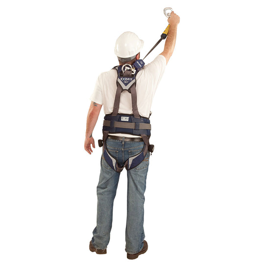 A construction worker, back view, wears an ExoFit NEX harness with a 3M DBI-SALA Nano-Lok Single Leg SRL, showcasing its lightweight, compact design and scaffold hook attachment for enhanced fall protection.