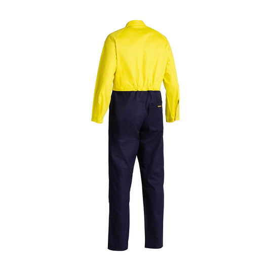 Bisley Hi Vis Cotton Drill Coverall, featuring a bright yellow top and navy blue bottom, showcases double-layered knees, multiple pockets, and metal press studs, designed for durability and workplace safety.