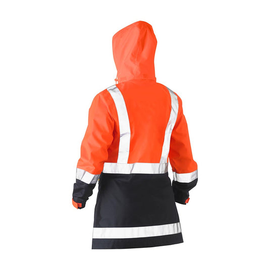 Bisley Hi Vis Women’s Taped Rain Jacket features a bright orange upper with navy lower section, reflective stripes, seam-sealed construction, and a concealed hood, ideal for enhanced visibility and waterproof protection.