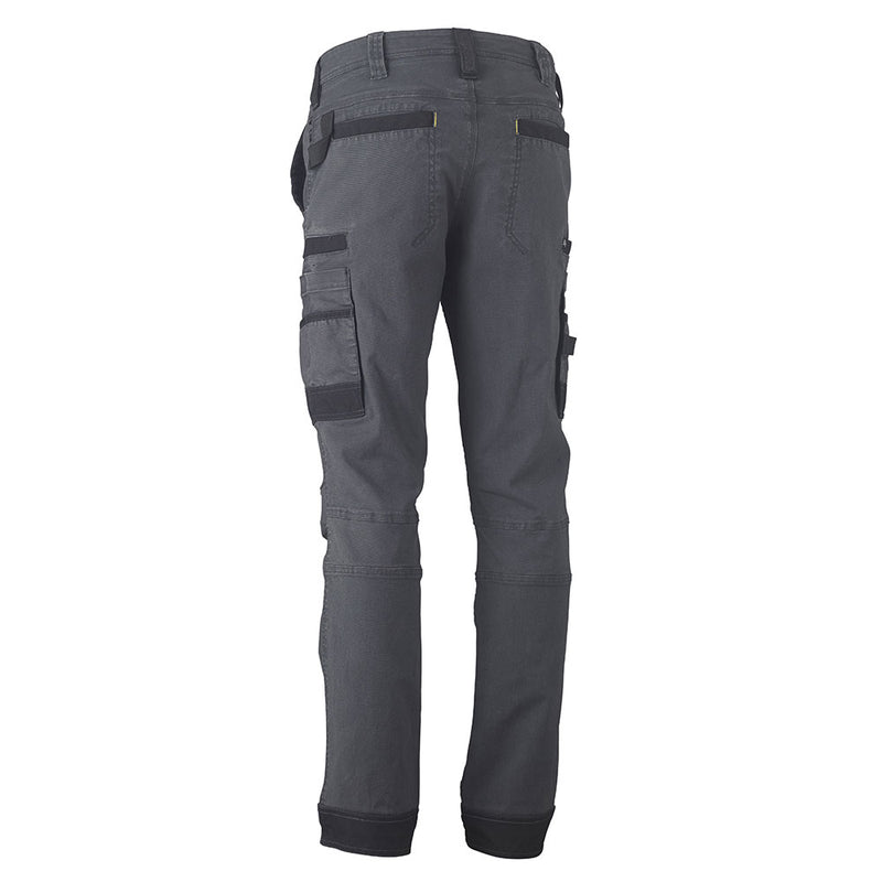 Load image into Gallery viewer, Bisley Flex &amp; Move Stretch Utility Cargo Pants featuring a close-up of multifunctional pockets, contoured leg design, and durable Cordura® reinforcements, ideal for workplace safety and mobility.
