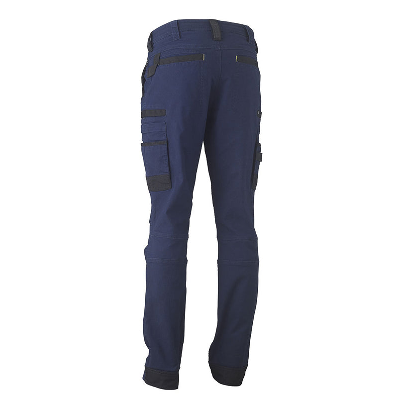Load image into Gallery viewer, Bisley Flex &amp; Move Stretch Utility Cargo Pants showcasing a close-up of a reinforced denim pocket with Cordura® highlights, emphasizing durability and multifunctional design, ideal for active workplaces.
