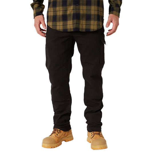 Jet Pilot Fueled Utility Pant showcased on a model, highlighting its articulated knees and reinforced pockets, paired with rugged work boots, depicting durability and comfort ideal for active job site conditions.