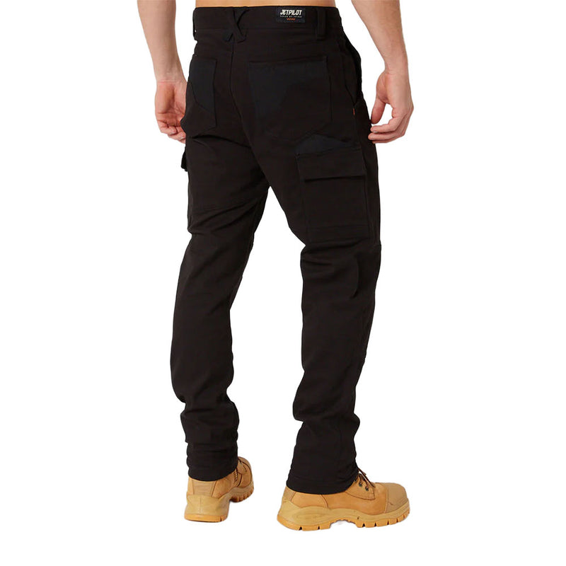 Load image into Gallery viewer, The image displays a back view of a person wearing Jet Pilot Fueled Utility Pant, highlighting slim-fit cargo design with flap pockets, paired with work boots, emphasizing comfort and performance for active job site roles.
