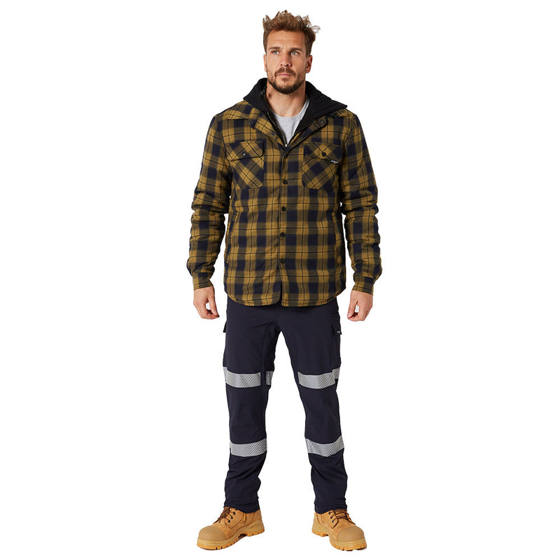 Load image into Gallery viewer, Man wearing Jetpilot Jet-Lite Stretch Tape Utility Pant, Navy, with reflective bands on thighs and calves, suitable for outdoor work, highlighting mobility, durability, and safety features. Paired with plaid jacket and work boots.
