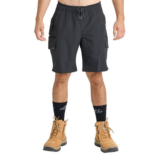 Jetpilot Jet Lite Hybrid 20 Utility Short features black cargo-style design with elastic drawstring waistband, flap thigh pockets, black crew socks, and tan suede work boots, reflecting durability and functionality.