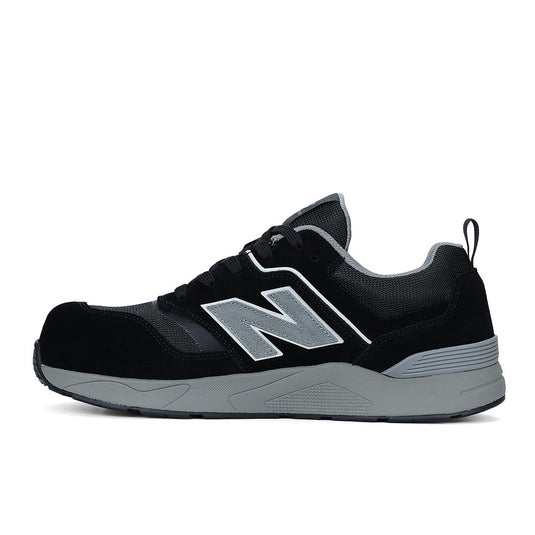 New Balance Elite Lite Safety Shoe, Black/Grey, featuring a composite safety toe, cushioned sole, and sleek N logo, ideal for comfort and safety in light-duty workplace conditions.