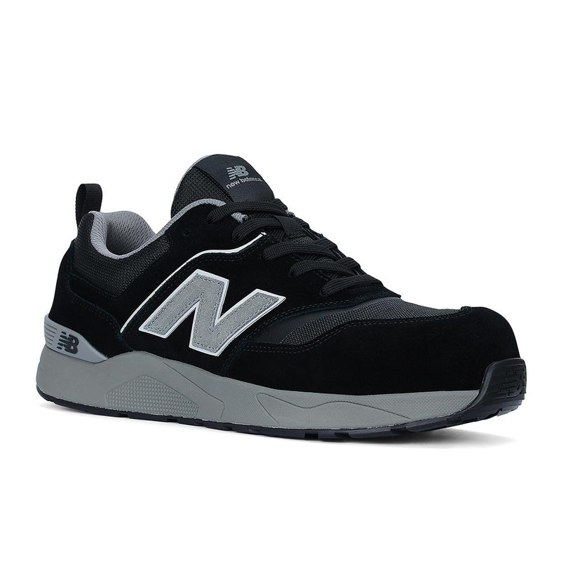 Load image into Gallery viewer, New Balance Elite Lite Safety Shoe, Black/Grey, featuring mesh-and-suede upper, New Balance “N” logo, padded collar, chunky midsole, and composite safety toe for stylish, protective workplace wear.
