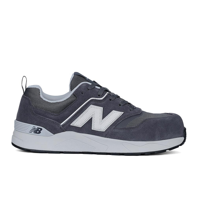 New Balance Elite Lite Safety Shoe, Grey/White, features a contemporary design with grey suede and mesh upper, composite toe, and slip-resistant outsole, ideal for light-duty workplace safety and comfort.