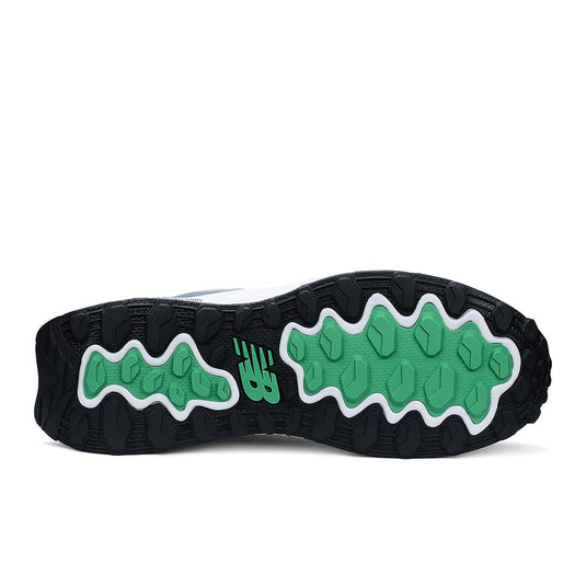 Underside view of the New Balance Fresh Foam Cremorne 2E Safety Shoe, showcasing a black rubber sole with green traction pods and an NB logo, highlighting its slip-resistant and durable design.