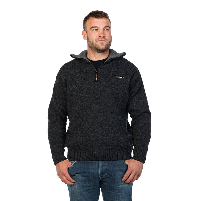 Load image into Gallery viewer, MKM Tasman Wool/Possum Jumper on a man in medium-wash jeans, showcasing its rugged, durable design. Ideal for outdoor performance, crafted with double-layer wool for comfort and temperature regulation.
