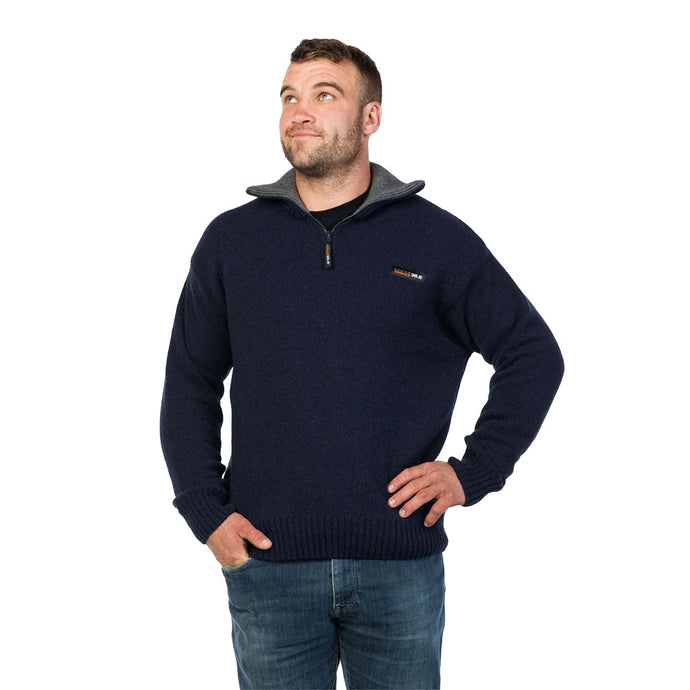 MKM Tasman Wool/Possum Jumper worn by a man; features a dark-navy, long-sleeved design with a quarter-zip collar, ideal for maintaining warmth and comfort during outdoor activities, aligning with Active Safety's reliable workwear ethos.